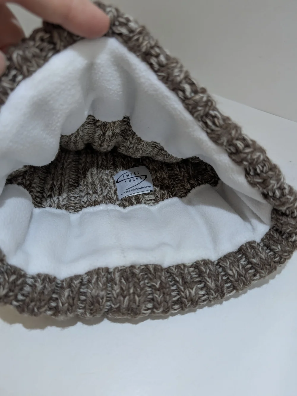 Sweet Turns knit pompom fleece lined beanie hat